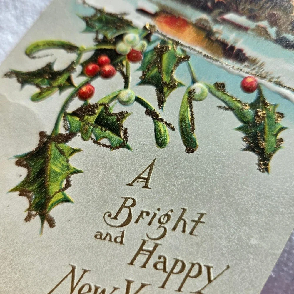 Antique New Year Postcard Holly Mistletoe Winter Sunset Gold Gilt Embossed 1910s